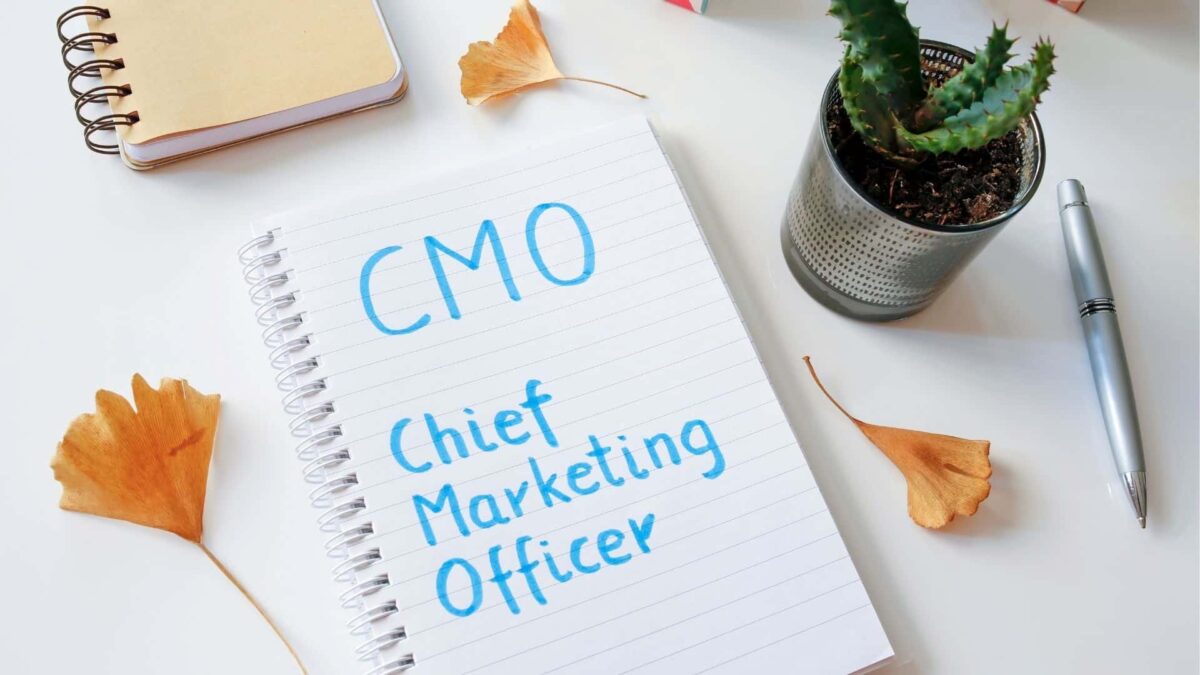 notebook with the text CMO chief marketing officer written in blue